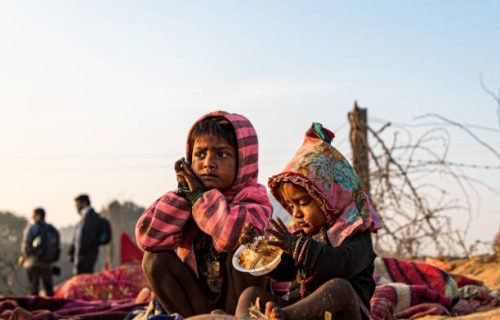 portrait of a poor kid eating food
